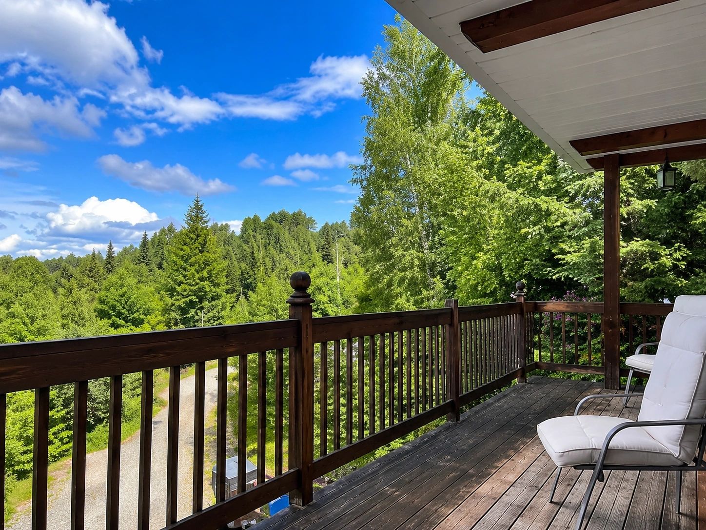 Covered deck of Lake Paradis Domain with views of the Laurentian forest